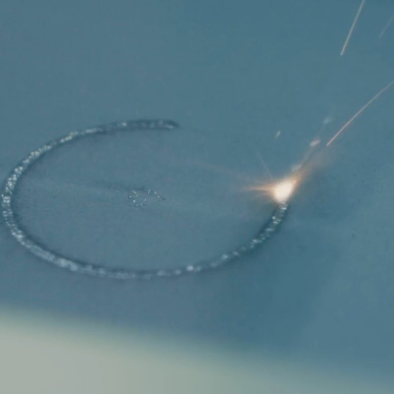 Laser melting a ring section in a metal powder bed